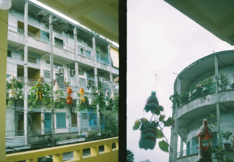 an outside view of an apartment building in the day and the night