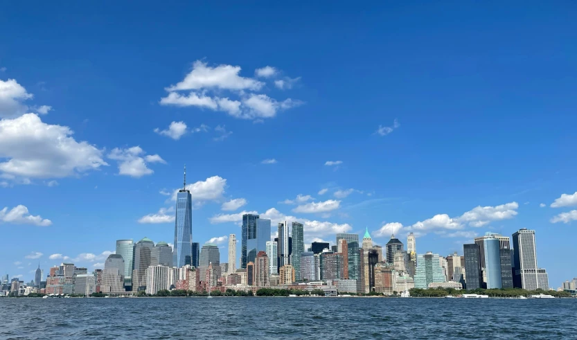 the city is along the river with tall buildings