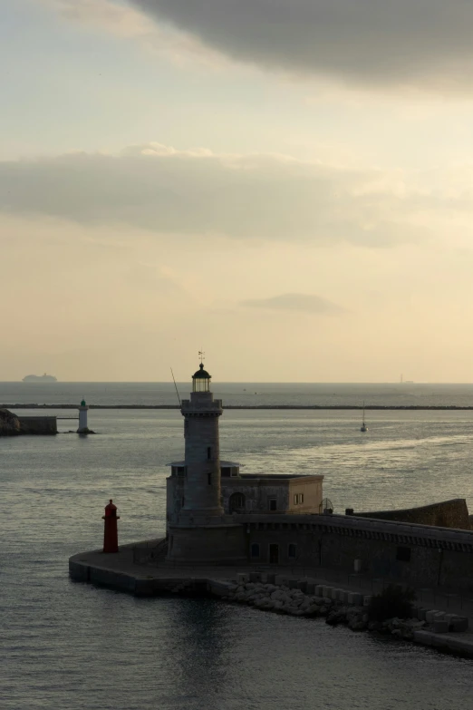 a lighthouse in the middle of the ocean