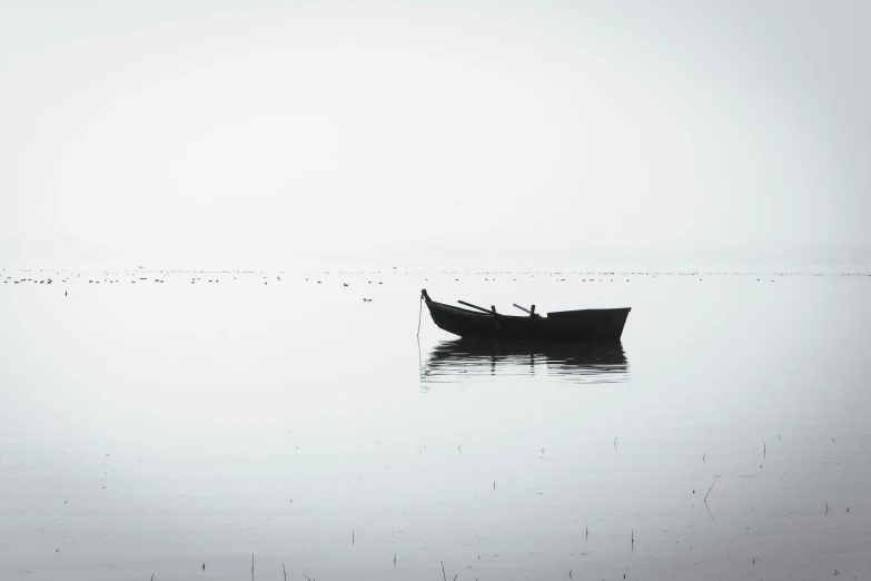 a boat that is in the water on the horizon