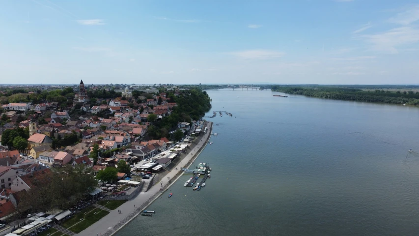 an aerial view of a village on a lake