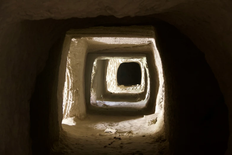 light coming through the tunnel in which we can see the entrance