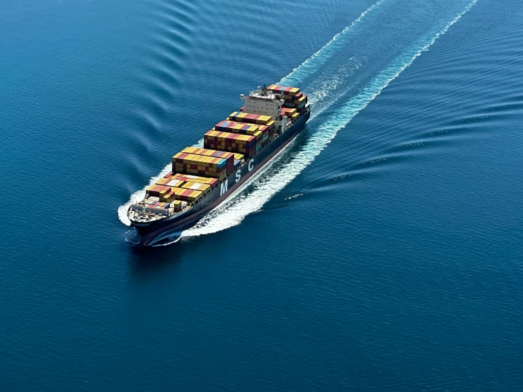 a large cargo ship sailing across a body of water