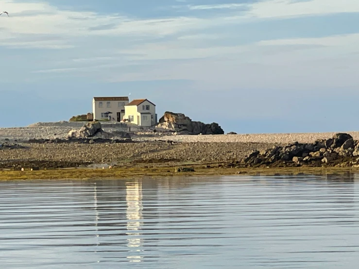 a building sitting in the middle of the water