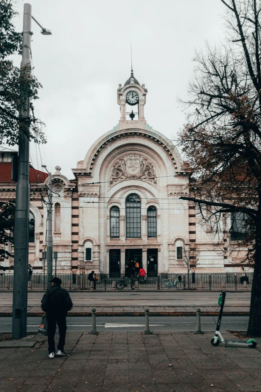 the building has a clock and a steeple on top