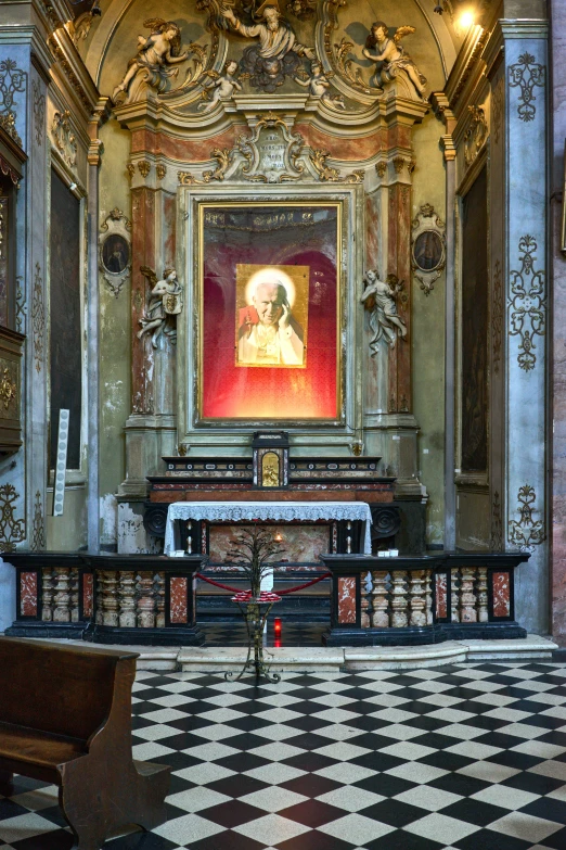 a very old church has ornate ceilings and a painting on it