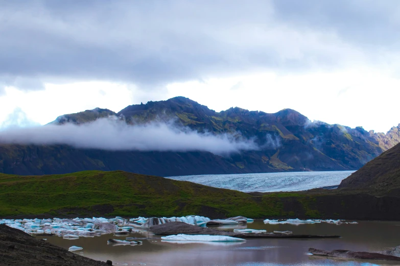 some mountain peaks and water in the middle