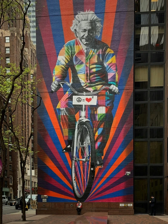 a bicycle parked in front of a colorful wall