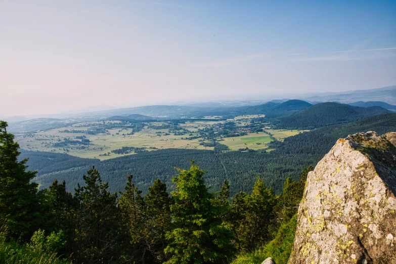 an overlook looking down on some forested terrain