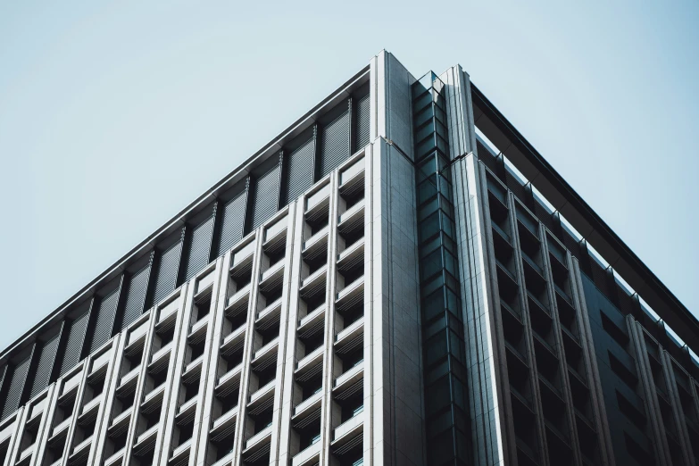 a tall building with balconies near the top