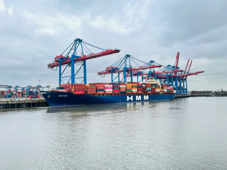 cargo containers are on a large boat docked in the ocean