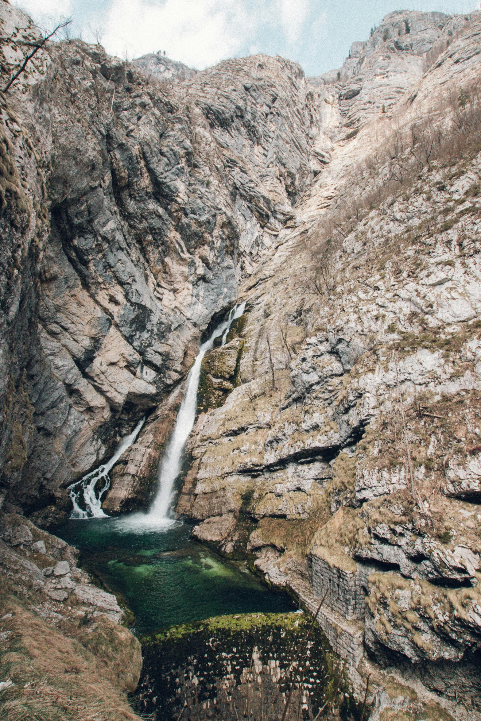 a waterfall near a rocky outcropping with no other water