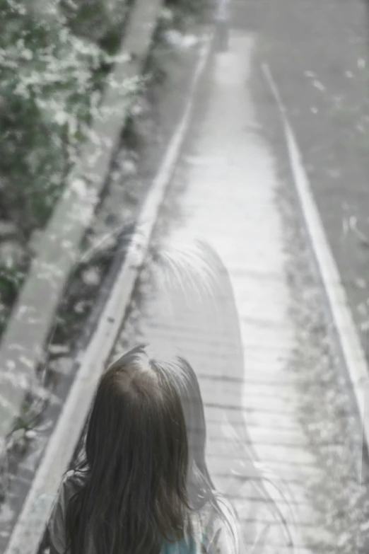 a little girl walking down a flight of stairs