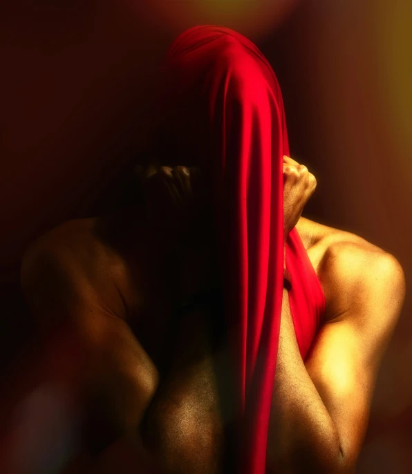 a man's chest is seen dd in red fabric