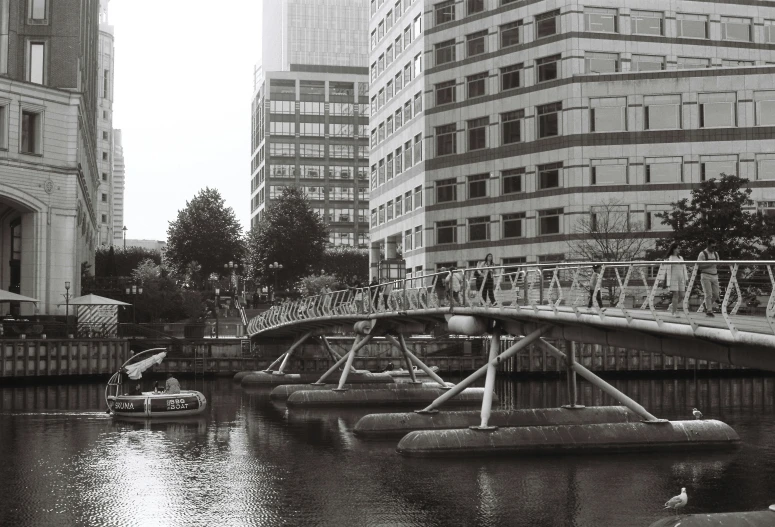 a river runs through a city with a bridge and buildings