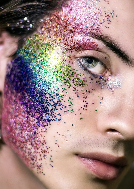 a woman's face with sprinkles on her face