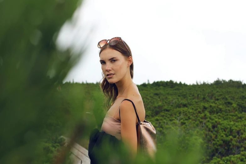 a woman in a bathing suit is looking ahead