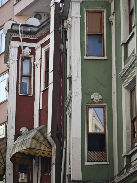 a street corner building with the outside of a closed window