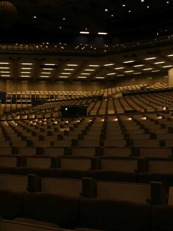 a large room filled with empty rows of seats