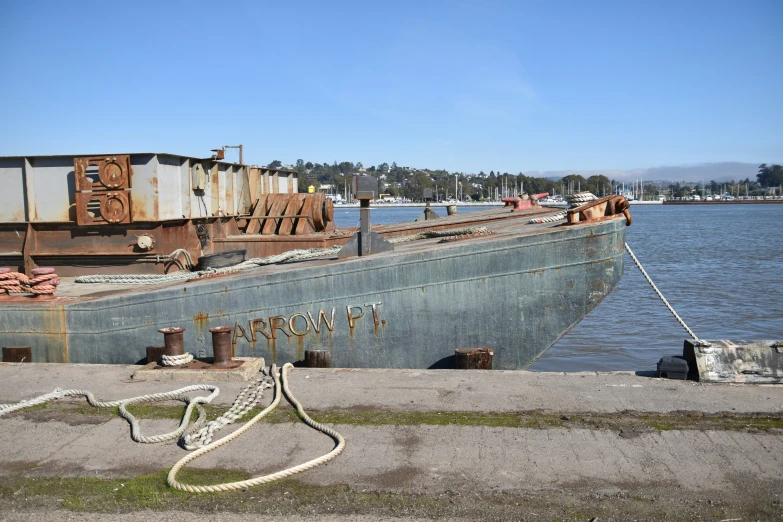 a ship on dry dock next to water