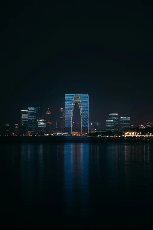 a city skyline with lots of tall buildings at night