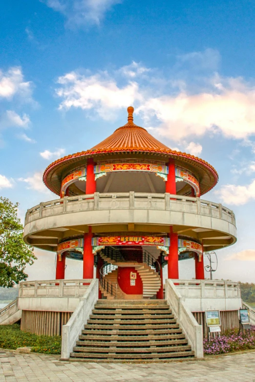 an oriental temple with stairs up and colorful architecture