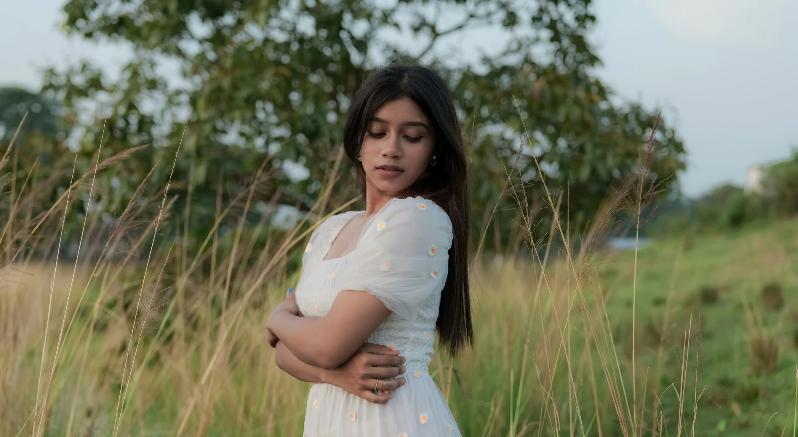 the  is hugging her mother on the grass