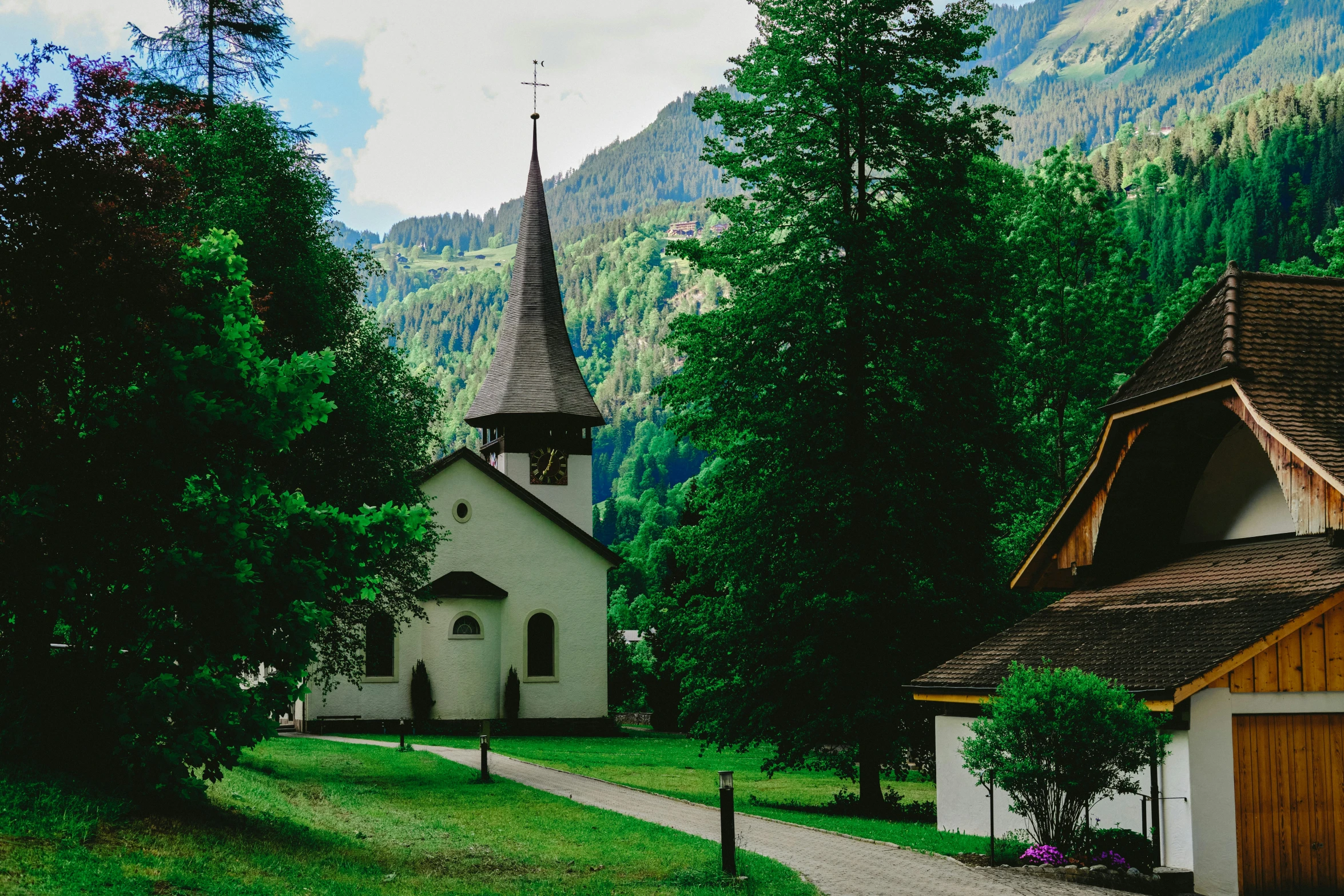 an old village with a church and tall steeple