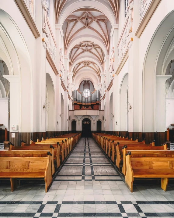 the inside of an old church with wooden pews