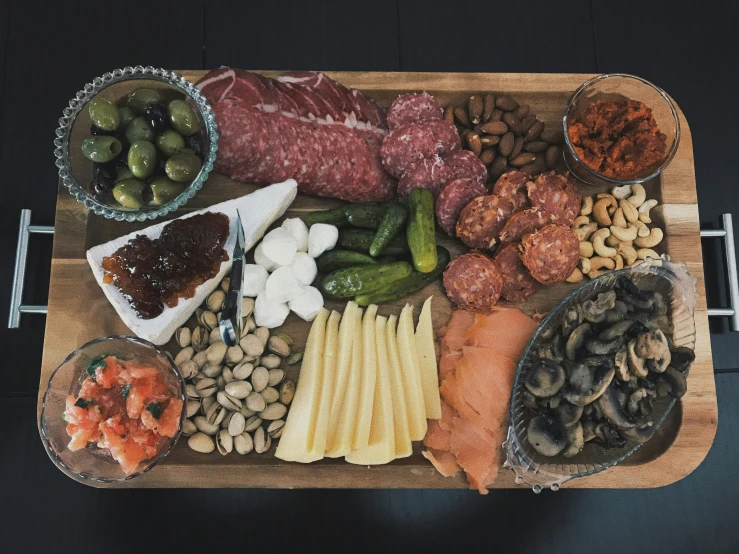 the platter contains all kinds of meats, beans and more