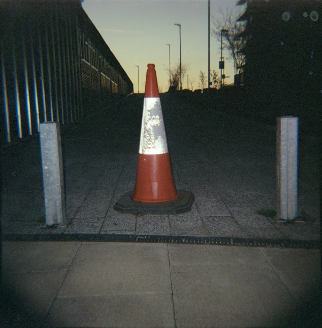 a fire hydrant on the street next to orange and white cones