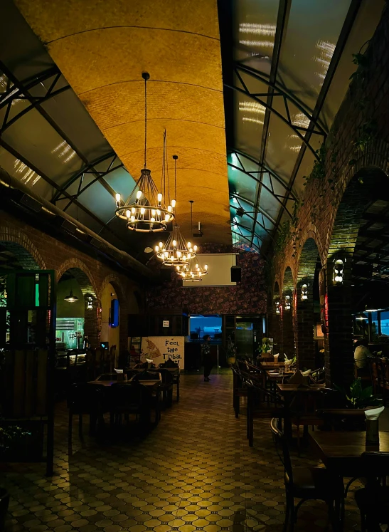 the interior of a fancy restaurant with a chandelier hanging