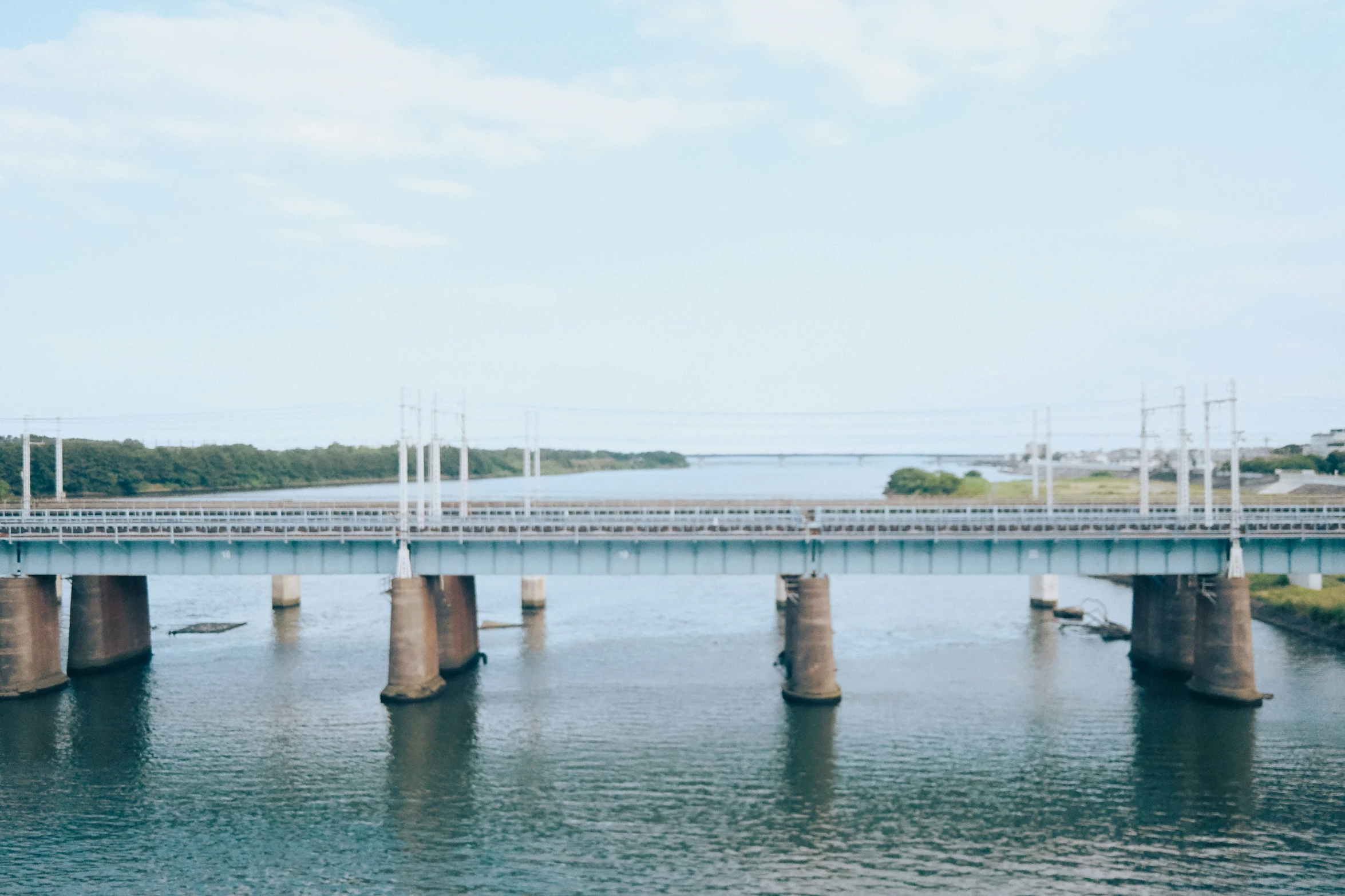 several poles in the middle of a large body of water