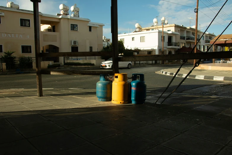 blue and yellow cylinders on the street