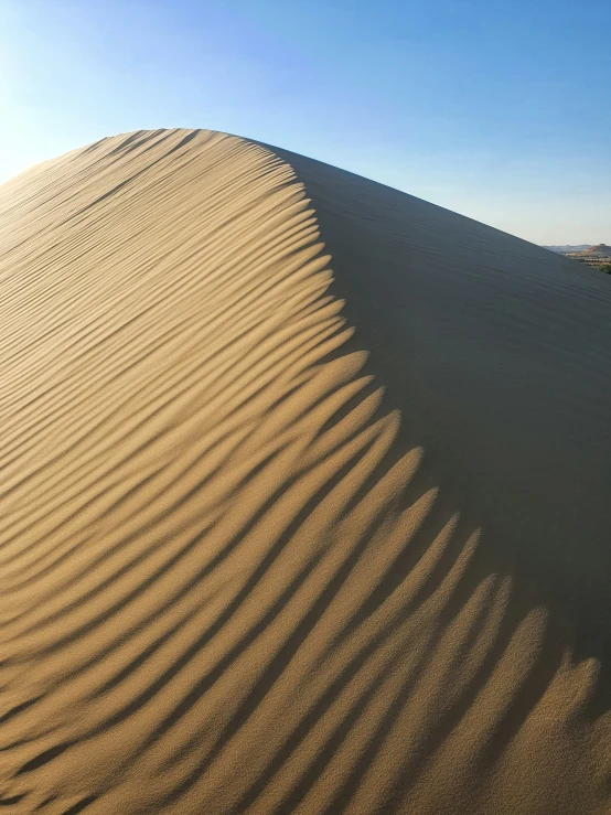 a lone person on a sand dune alone