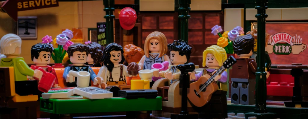 a scene with legos in the middle and people sitting