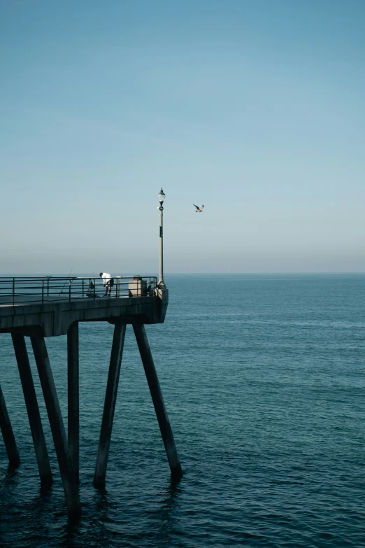 an ocean with a body of water and a pier