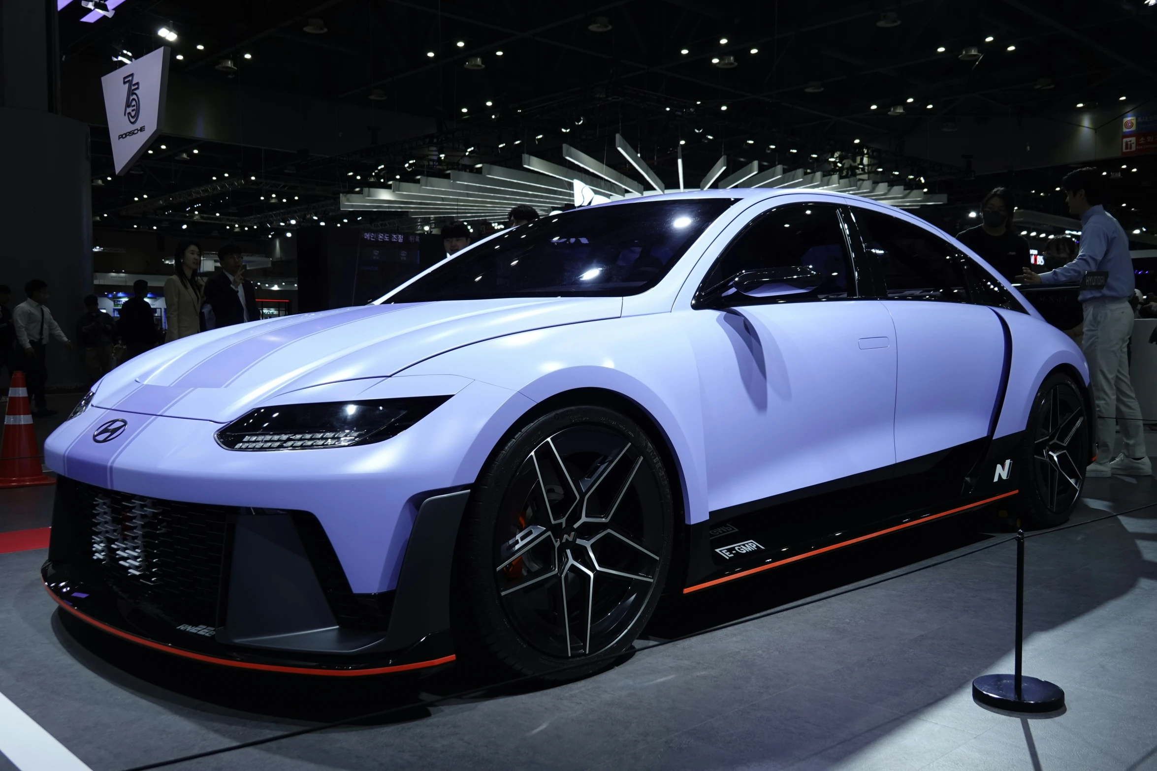 a blue and black car on display at an auto show