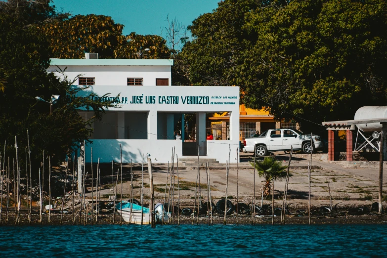 a boat is parked in front of a white house