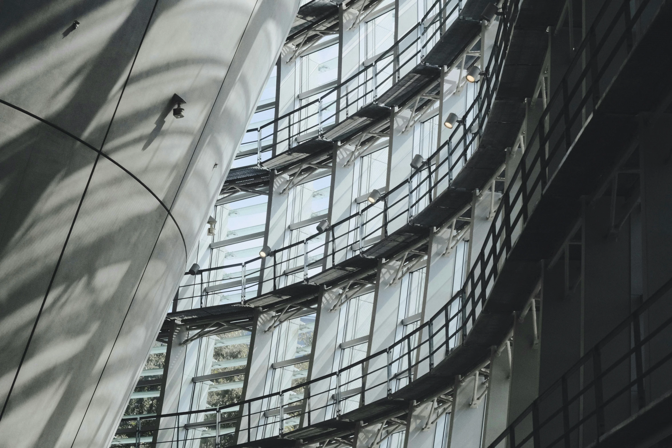 a view looking up at a glassed building