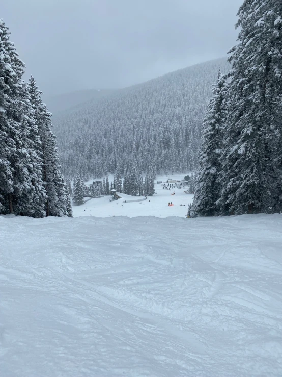 a skier is coming down the hill with his board