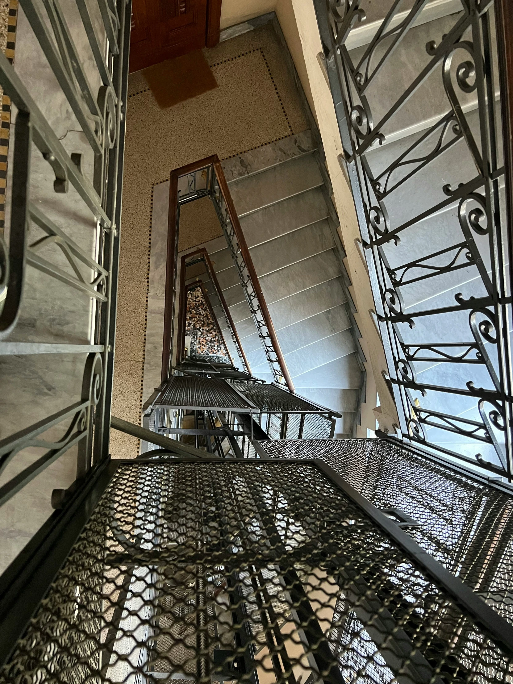 metal stairs in an old building with wrought iron railing