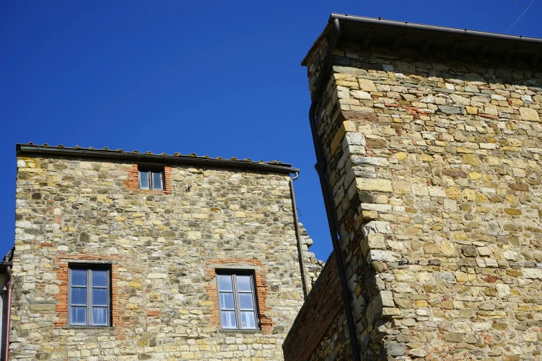 two stone towers and windows are visible from underneath