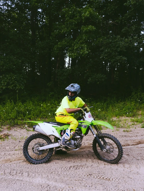 a man riding on the back of a dirt bike