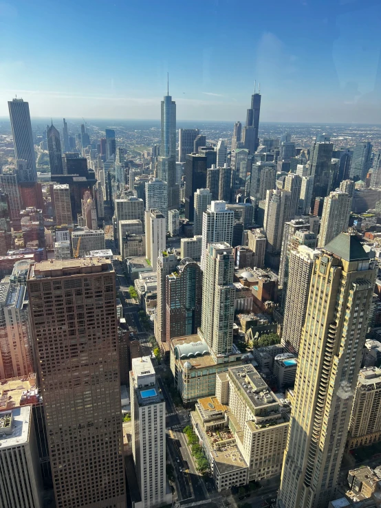 a view from the top of a skyscr building with some large buildings