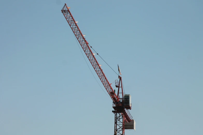 a crane is standing tall in the sky