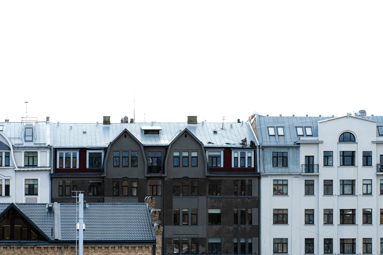 tall buildings stand in front of each other on a cold day