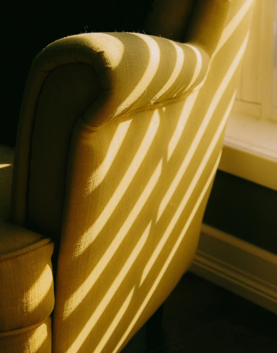 chair near a window with sunlight coming in