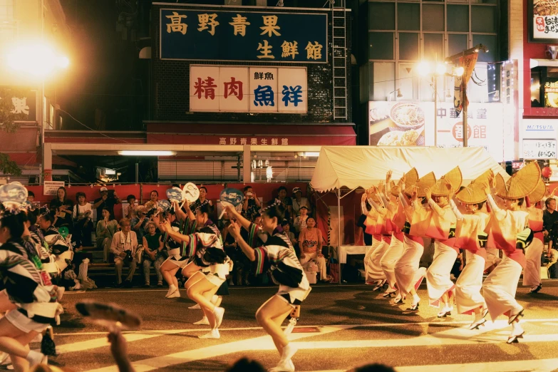 a group of dancers performing in front of an audience