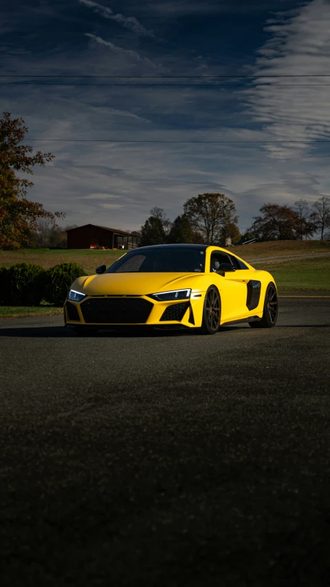 a sports car sitting on the road at night